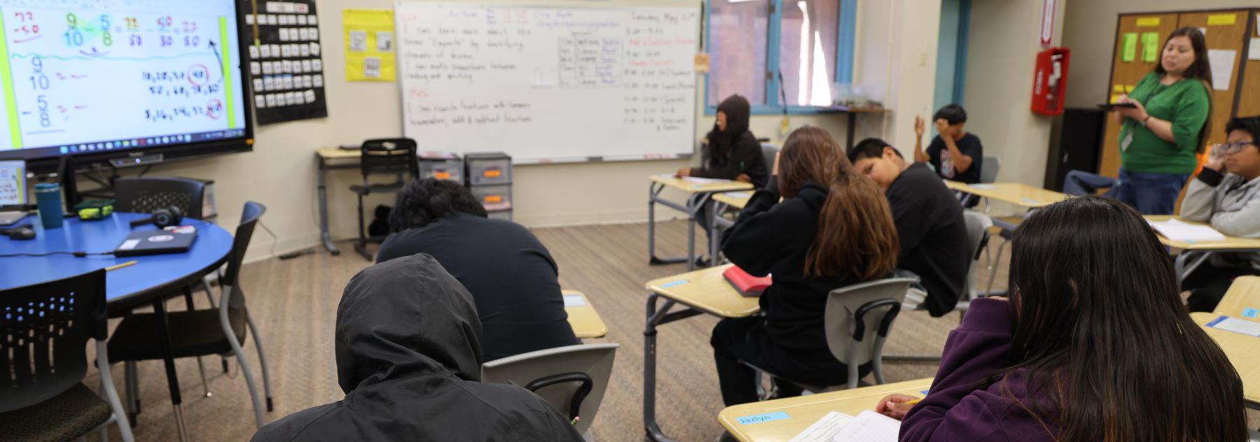 A classroom at Havasupai Elementary School, with students at desks and a teacher standing in front of them.